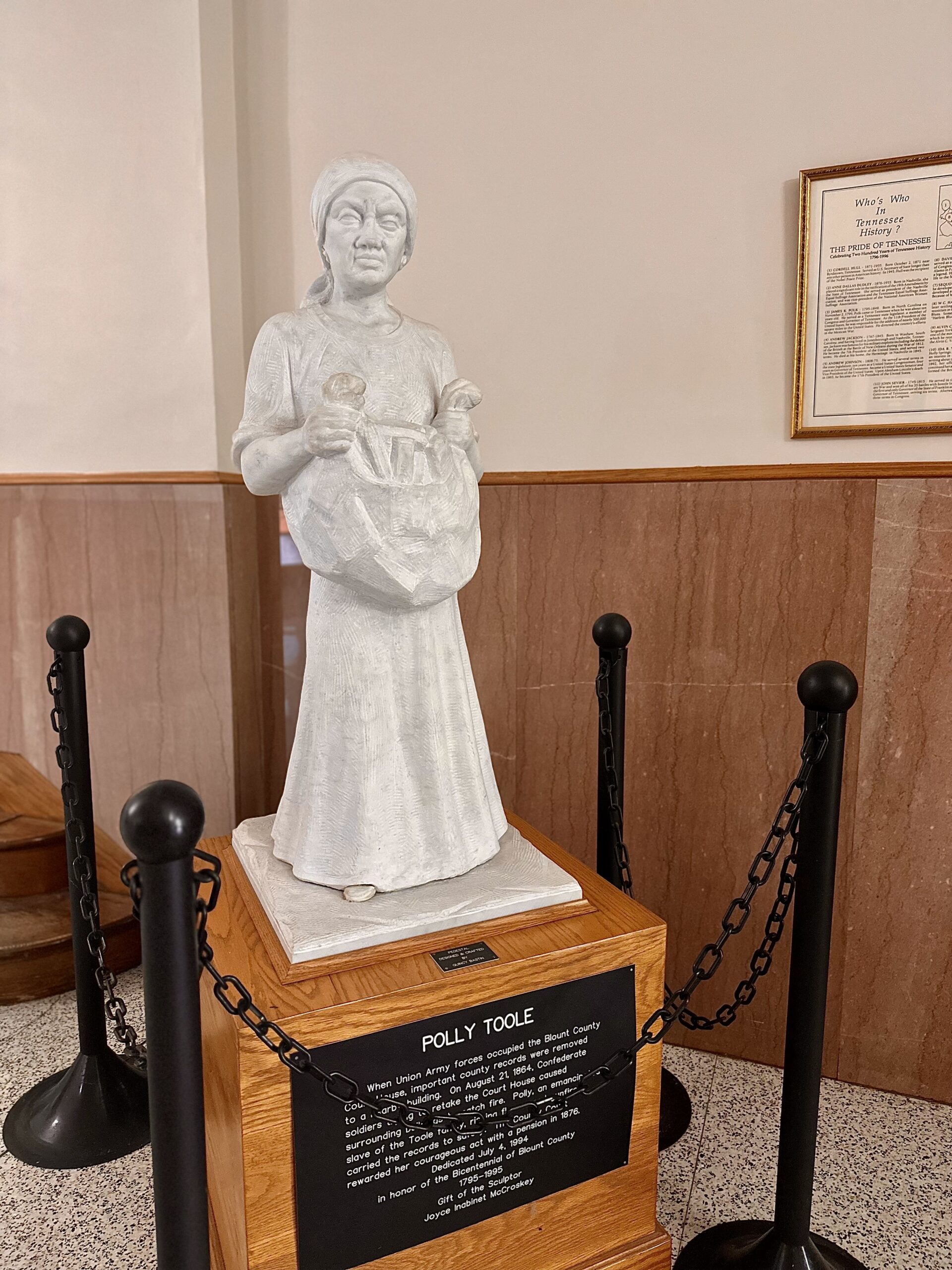 Statue of Polly Toole, with her apron full of county documents, stands in the Blount County Courthouse in Maryville, Tennessee